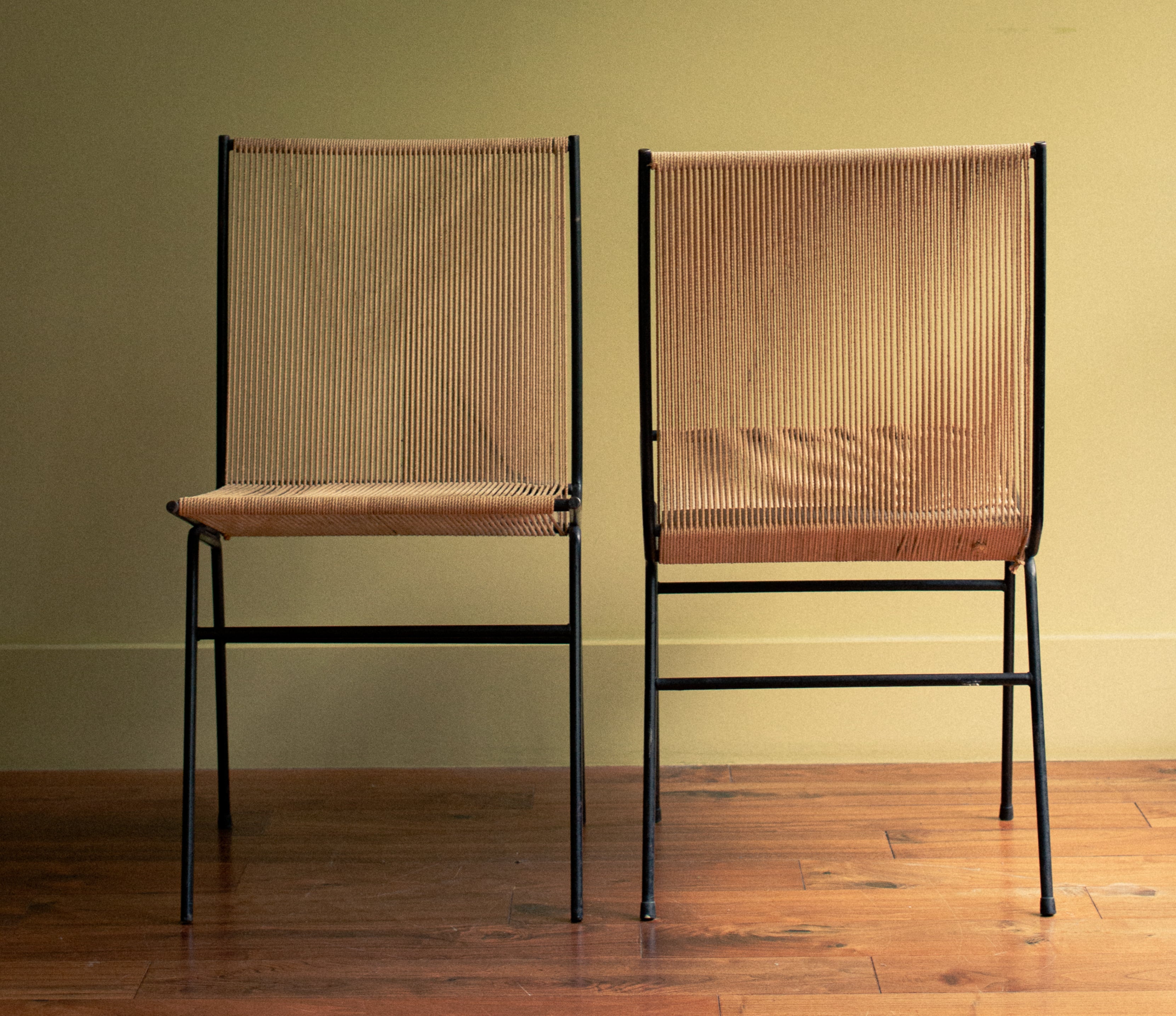 Rare pair of chairs in iron with original cords, anonymous, early 1950