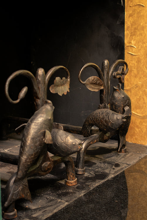 Andirons with oak leaves and fish, 1940